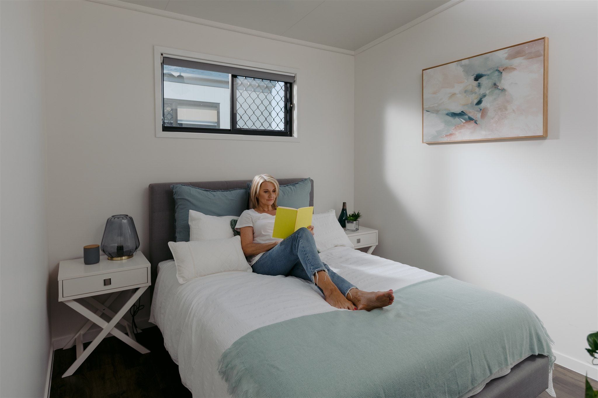 Ingenia Rental Durack 2 Bedroom Condo bedroom with resident reading